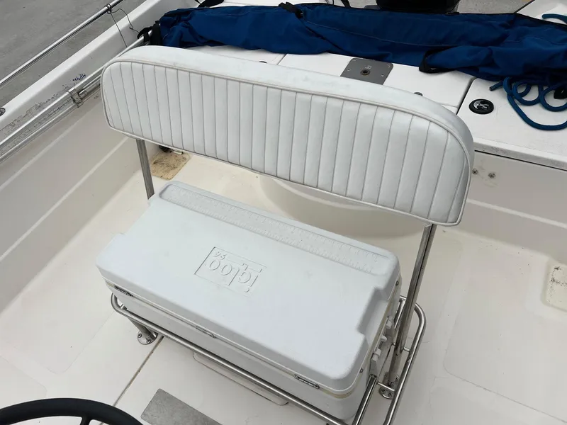 Slide: The Image of 2001 Skeeter ZX 2200 boat interior with white cushioned seat and cooler. - 10