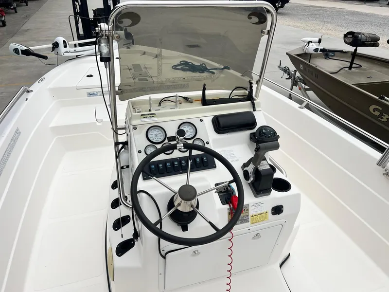 Slide: The Image of 2001 Skeeter ZX 2200 boat console with steering wheel and controls. - 11