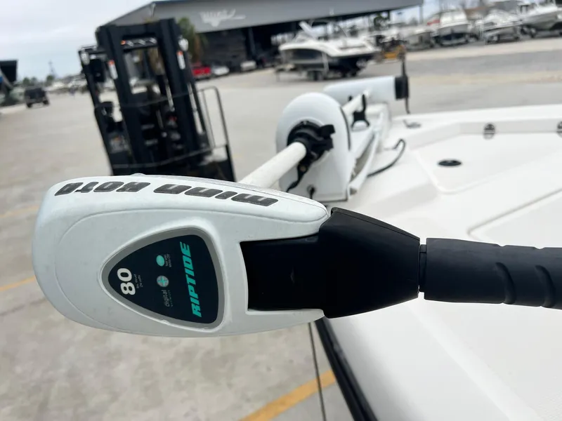 Slide: The Image of 2001 Skeeter ZX 2200 boat with Minn Kota Riptide trolling motor in a marina setting. - 7