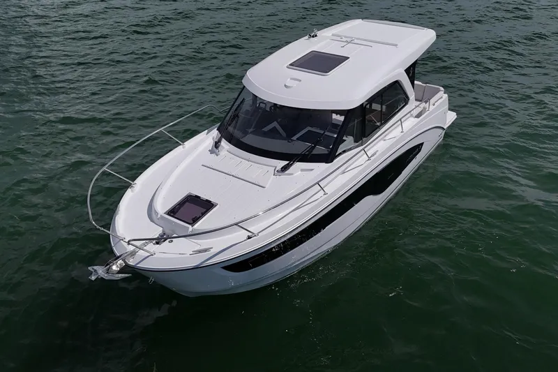 Slide: The Image of 2026 Beneteau Antares 9 V2 boat cruising on open water. - 10