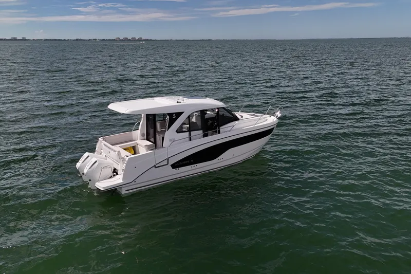 Slide: The Image of 2026 Beneteau Antares 9 V2 cruising on open water under a clear sky. - 12
