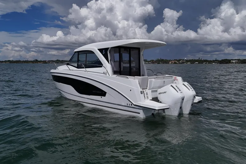 Slide: The Image of 2026 Beneteau Antares 9 V2 boat on water, featuring twin Mercury engines. - 2