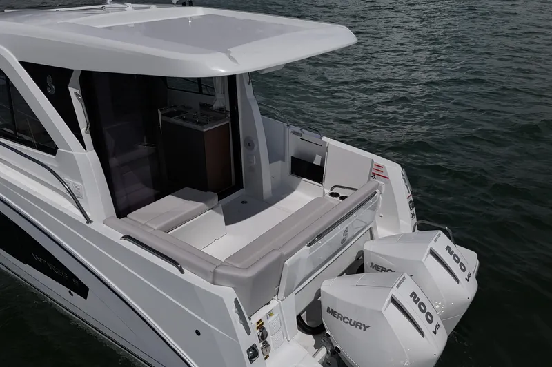 Slide: The Image of 2026 Beneteau Antares 9 V2 boat with twin Mercury engines on water. - 8