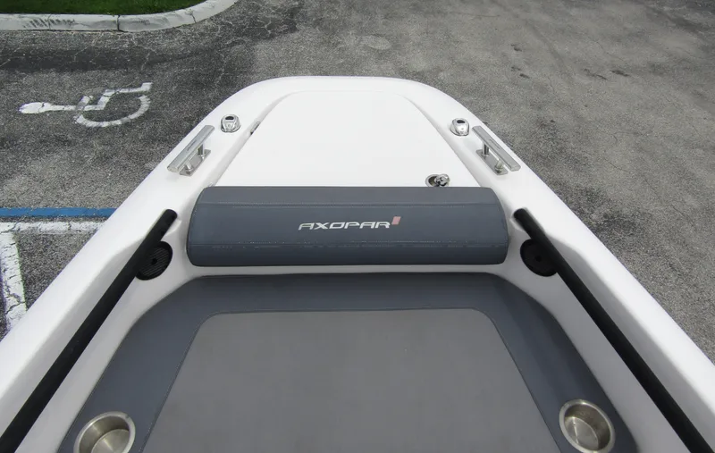 Slide: The Image of 2022 Axopar 22 T-Top boat bow with seating and cup holders. - 6