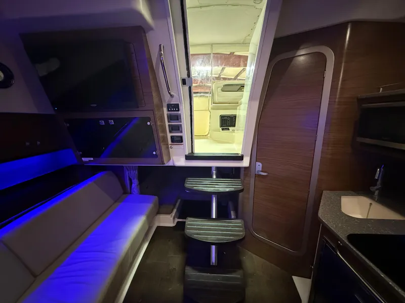 Slide: The Image of Interior of 2018 Boston Whaler 345 Conquest, featuring modern seating and ambient lighting. - 19