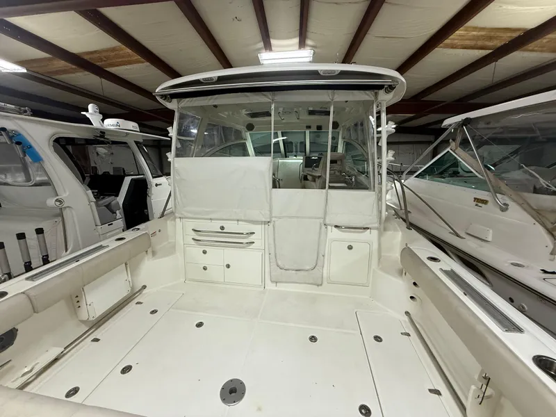 Slide: The Image of 2018 Boston Whaler 345 Conquest boat interior in storage facility. - 2