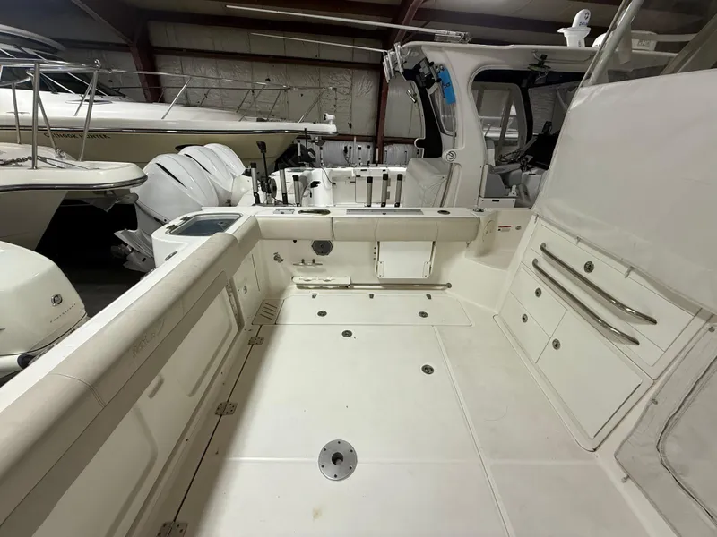 Slide: The Image of 2018 Boston Whaler 345 Conquest boat interior, spacious deck with storage compartments. - 3