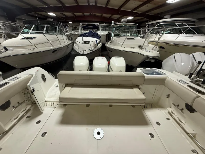 Slide: The Image of 2018 Boston Whaler 345 Conquest in storage, surrounded by other boats. - 4