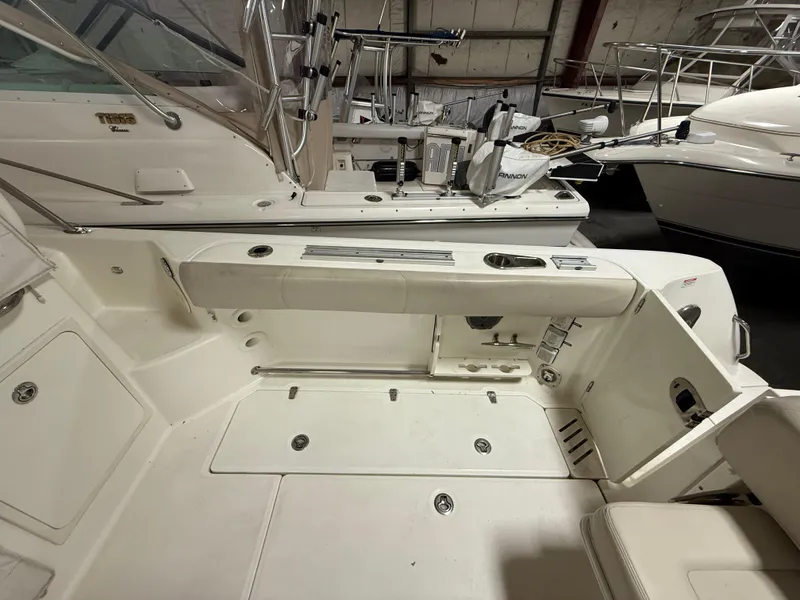 Slide: The Image of 2018 Boston Whaler 345 Conquest boat interior, featuring spacious deck and seating area. - 5