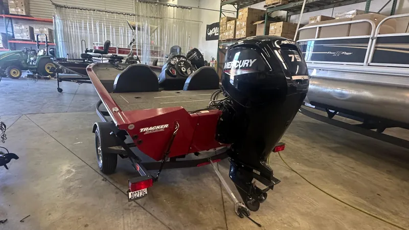 Slide: The Image of 2020 Tracker PRO175TXW boat with Mercury 75 engine in a showroom. - 4