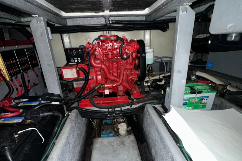 Slide: The Image of Engine room of 1995 Sea Ray 400 Express Cruiser with red engine and wiring. - 26
