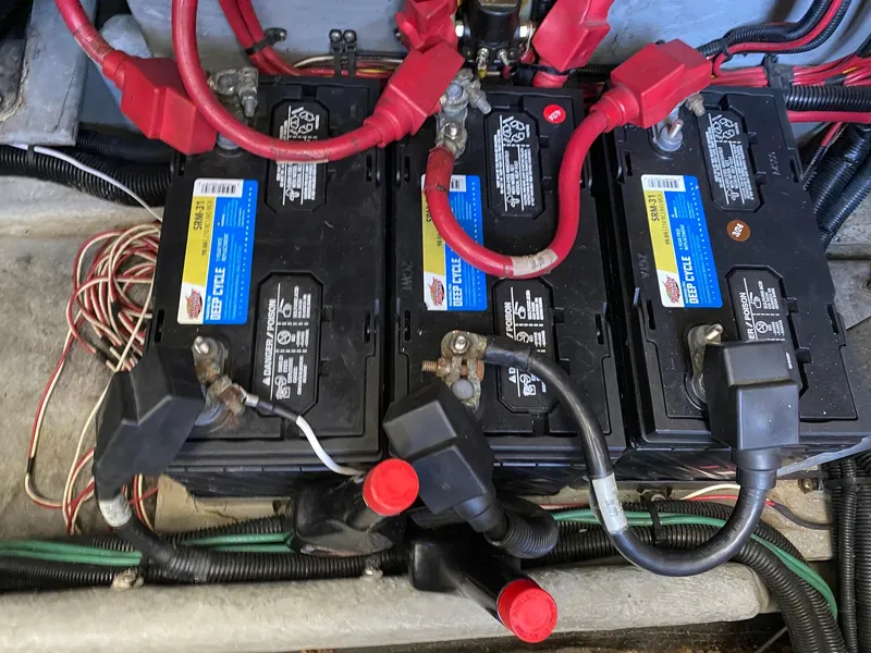 Slide: The Image of Batteries in a 1995 Sea Ray 400 Express Cruiser engine compartment. - 27