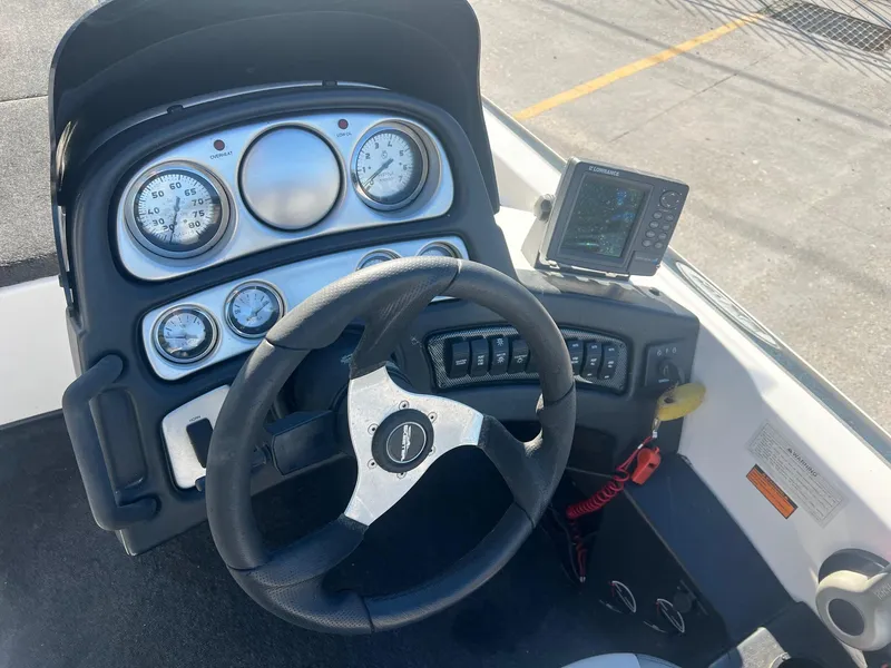 Slide: The Image of 2007 Skeeter ZX 190 boat dashboard with steering wheel and electronic display. - 4