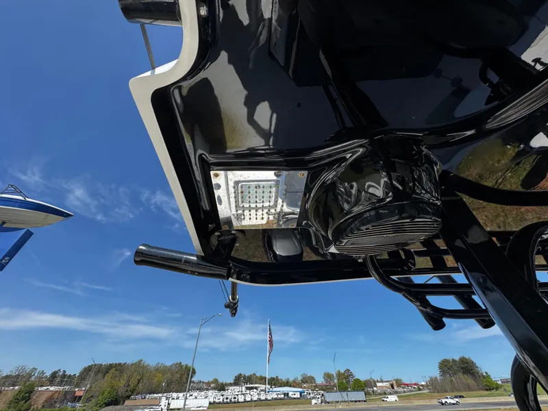 Slide: The Image of 2023 Sea Pro 320 DLX Center Console boat underside with clear sky background. - 15