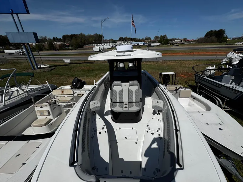 Slide: The Image of 2023 Sea Pro 320 DLX Center Console boat displayed outdoors. - 3