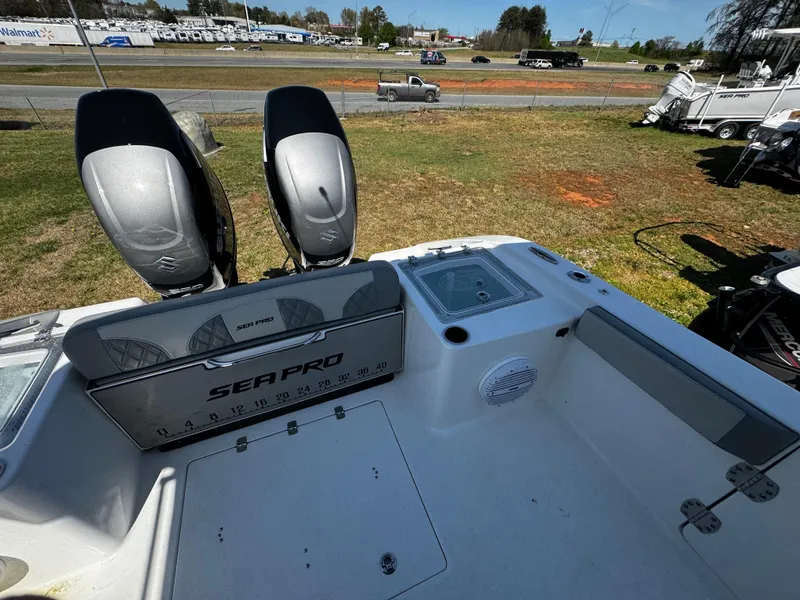 Slide: The Image of 2023 Sea Pro 320 DLX Center Console boat with dual engines, outdoor display. - 9