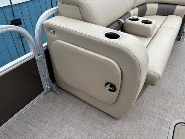 Slide: The Image of 2022 Sun Tracker SportFish 22 XP3 boat interior with beige seating and cup holders. - 15