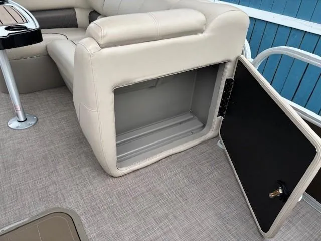 Slide: The Image of Sun Tracker SportFish 22 XP3 2022 boat seat with open storage compartment. - 26