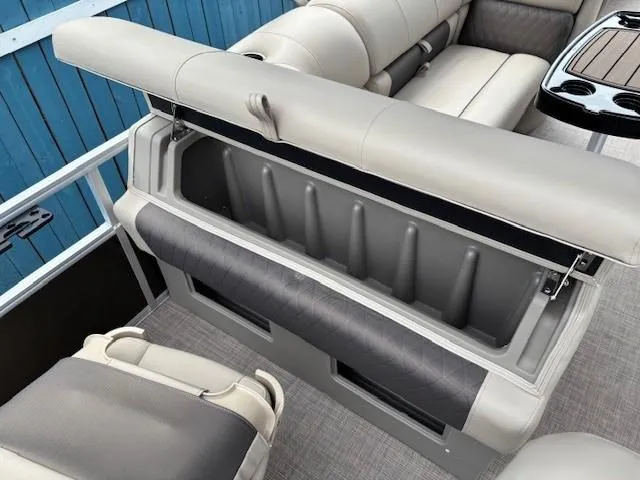 Slide: The Image of 2022 Sun Tracker SportFish 22 XP3 boat interior with open storage compartment and seating. - 31