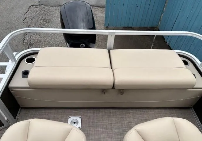 Slide: The Image of 2022 Sun Tracker SportFish 22 XP3 boat with beige seating and cup holders. - 32