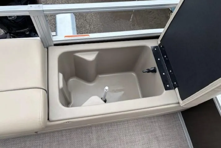 Slide: The Image of 2022 Sun Tracker SportFish 22 XP3 storage compartment with beige seating and open lid. - 33