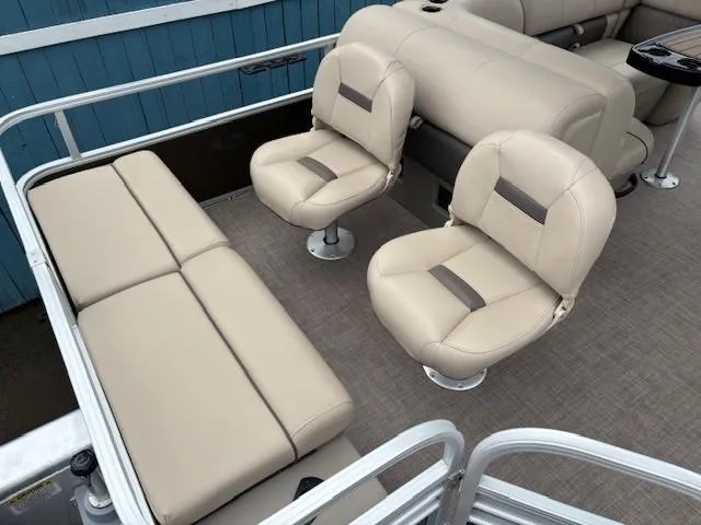 Slide: The Image of 2022 Sun Tracker SportFish 22 XP3 boat interior with beige seating and spacious layout. - 34