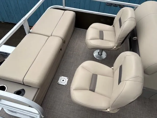 Slide: The Image of 2022 Sun Tracker SportFish 22 XP3 interior with beige seating and carpeted floor. - 35