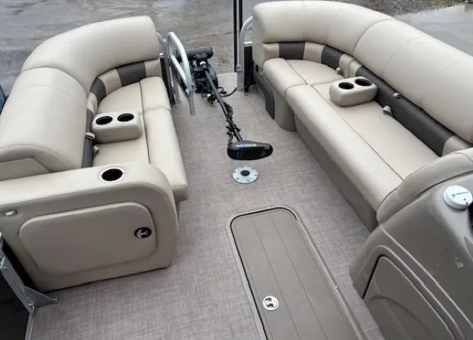 Slide: The Image of 2022 Sun Tracker SportFish 22 XP3 interior with beige seating and cup holders. - 7