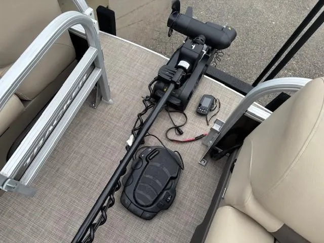 Slide: The Image of 2022 Sun Tracker SportFish 22 XP3 boat interior with trolling motor and seating. - 8