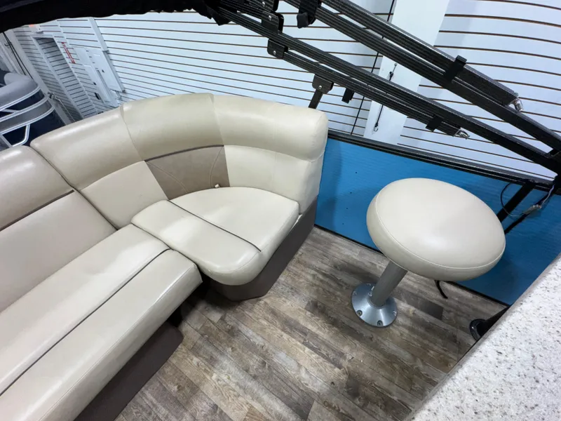 Slide: The Image of Luxurious seating area on 2019 Crest III 240 SLE boat with beige upholstery. - 27