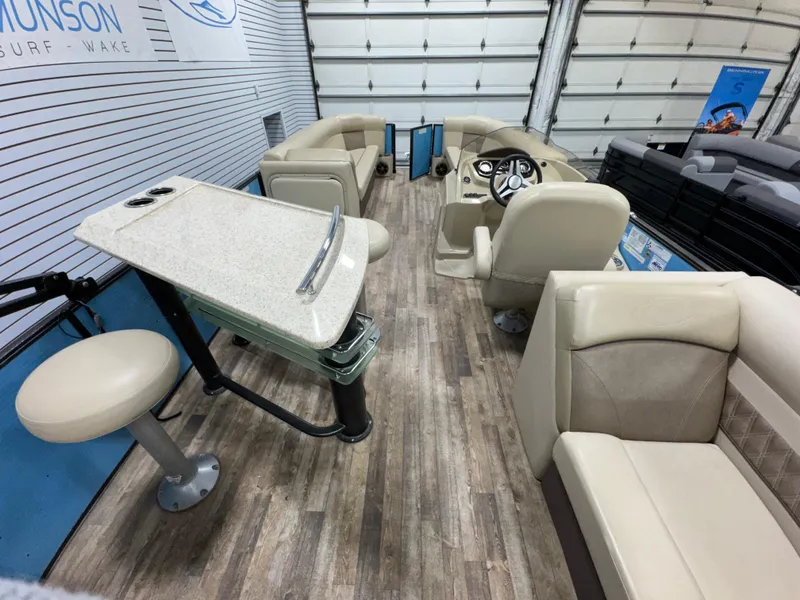 Slide: The Image of Interior of a 2019 Crest III 240 SLE pontoon boat with seating and steering console. - 28