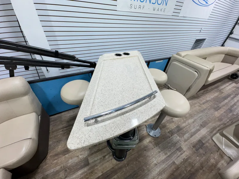 Slide: The Image of 2019 Crest III 240 SLE boat interior with seating and table, showcasing modern design. - 29