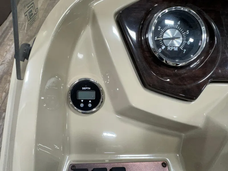 Slide: The Image of Dashboard of 2019 Crest III 240 SLE boat with RPM gauge and depth display. - 34