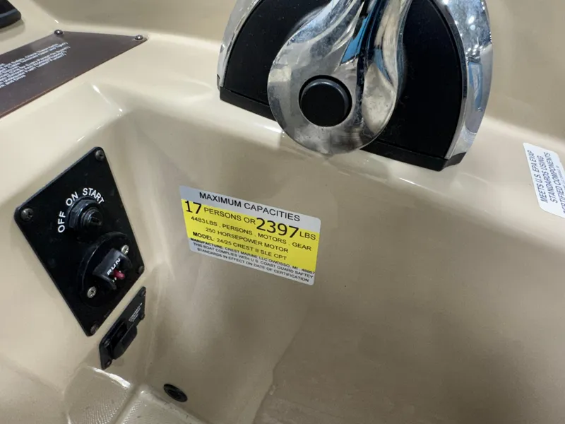 Slide: The Image of 2019 Crest III 240 SLE boat control panel with capacity label for 17 persons or 2397 lbs. - 36