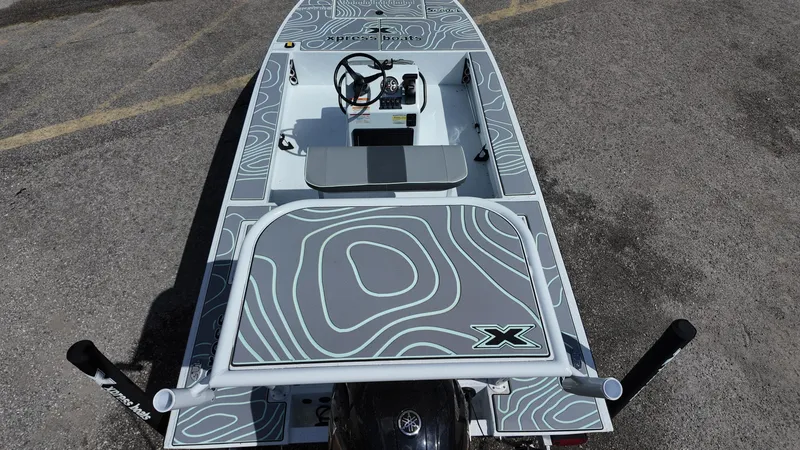 Slide: The Image of 2025 Xpress Skiff 185 boat with modern design and topographic pattern on deck. - 32