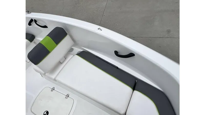 Slide: The Image of 2022 Tahoe T16 boat interior with white and green seating, featuring sleek design elements. - 10