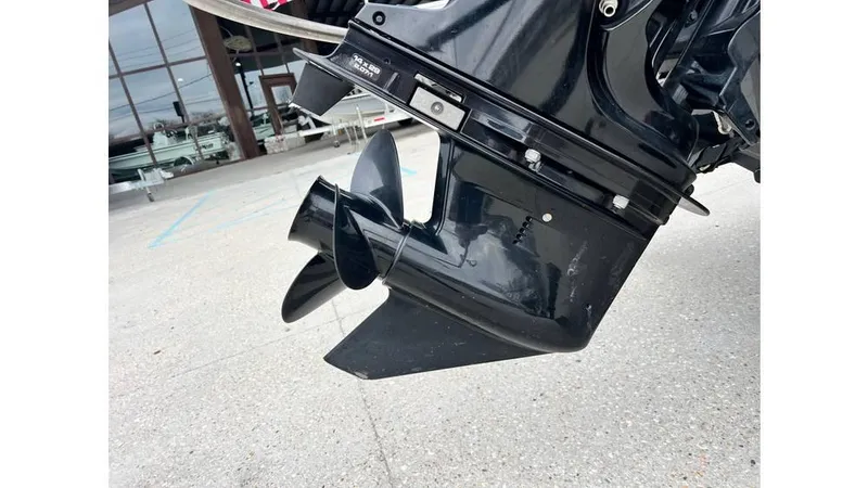 Slide: The Image of 2022 Tahoe T16 boat motor with propeller, displayed outdoors. - 4