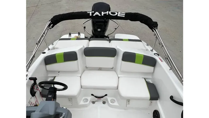 Slide: The Image of 2022 Tahoe T16 boat interior with cushioned seating and steering wheel. - 7