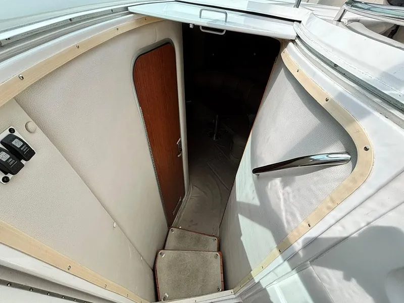 Slide: The Image of 2004 Chaparral 350 Signature boat interior entrance with steps and wooden door. - 10