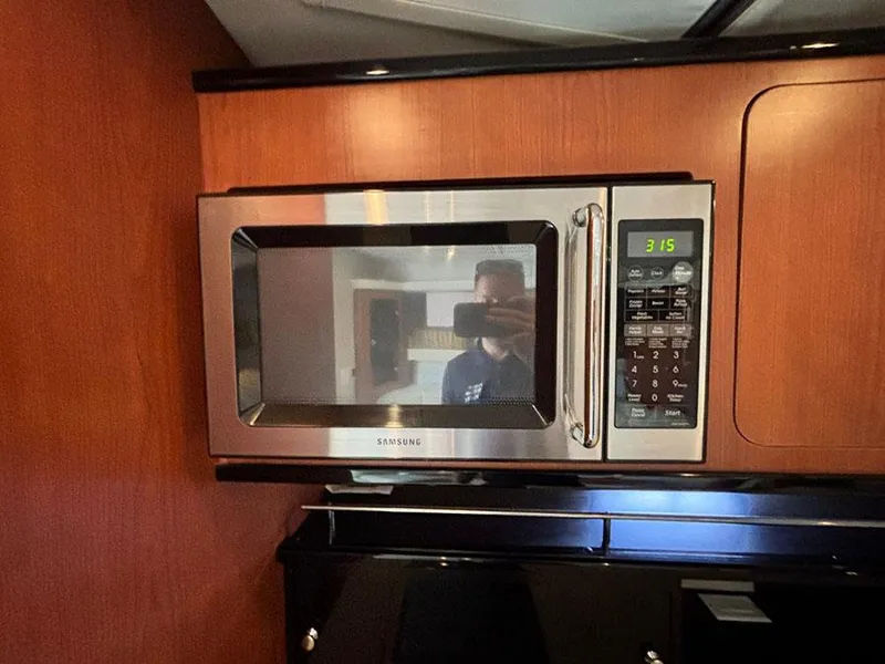 Slide: The Image of Samsung microwave in 2004 Chaparral 350 Signature yacht kitchen. - 18