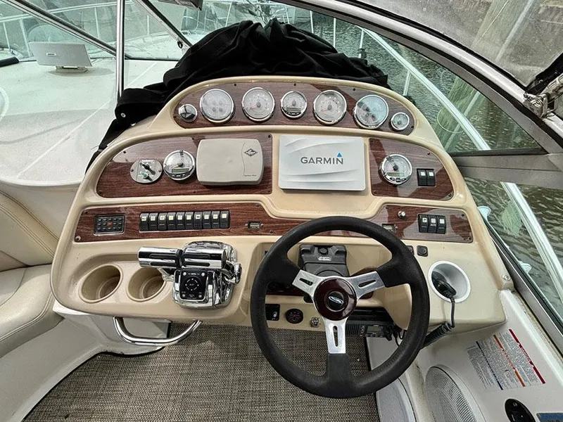 Slide: The Image of 2004 Chaparral 350 Signature boat dashboard with Garmin navigation system and control panel. - 3
