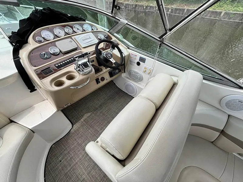 Slide: The Image of 2004 Chaparral 350 Signature boat cockpit with steering wheel and control panel. - 4