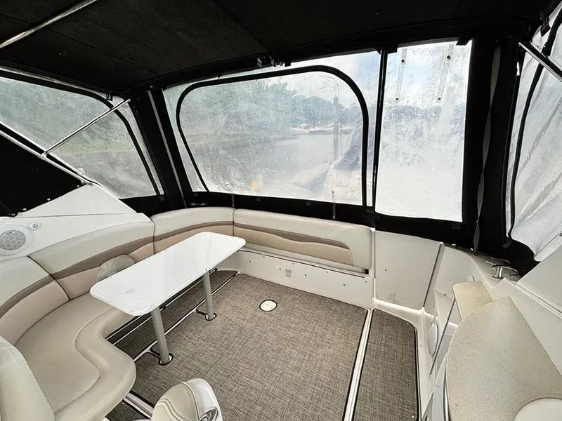 Slide: The Image of 2004 Chaparral 350 Signature boat interior with seating and table, enclosed by clear panels. - 5
