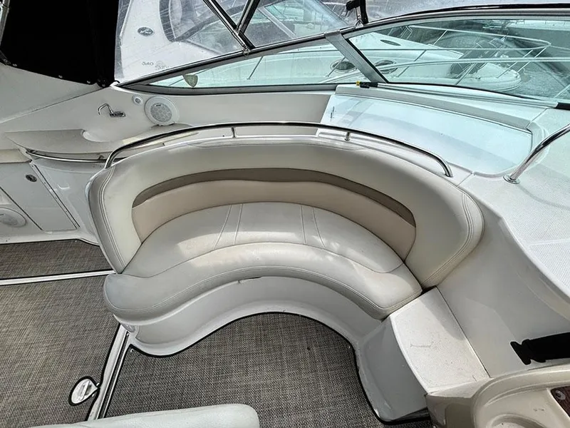 Slide: The Image of 2004 Chaparral 350 Signature boat interior with curved seating and modern design. - 6