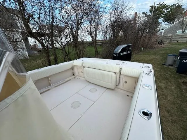 Slide: The Image of 2008 Grady-White Gulfstream 232 boat with spacious deck and Suzuki outboard motor. - 10