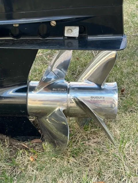 Slide: The Image of Close-up of a Suzuki propeller on a 2008 Grady-White Gulfstream 232 boat. - 2