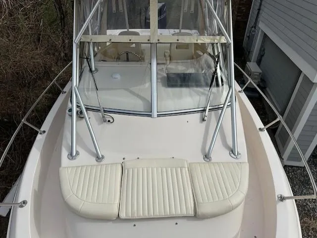 Slide: The Image of 2008 Grady-White Gulfstream 232 boat with cushioned seating and protective windshield. - 4