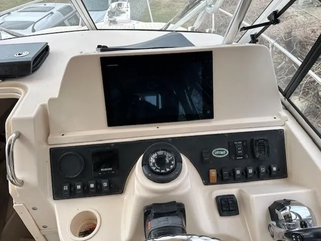 Slide: The Image of Control panel of a 2008 Grady-White Gulfstream 232 boat with navigation equipment. - 7