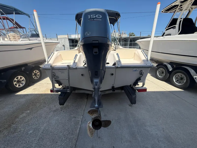 Slide: The Image of 2011 Grady-White Freedom 192 boat with 150 HP engine, parked on a trailer. - 13