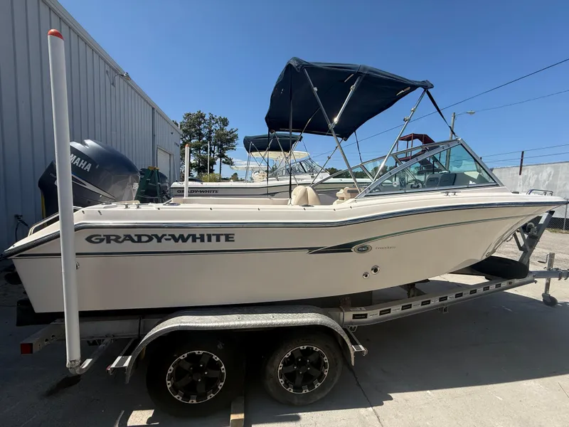 Slide: The Image of 2011 Grady-White Freedom 192 boat on trailer, parked outdoors. - 19
